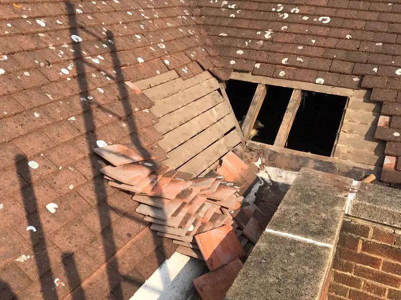 Roof repair work London on a pitched roof by City Building and Roofing Ltd