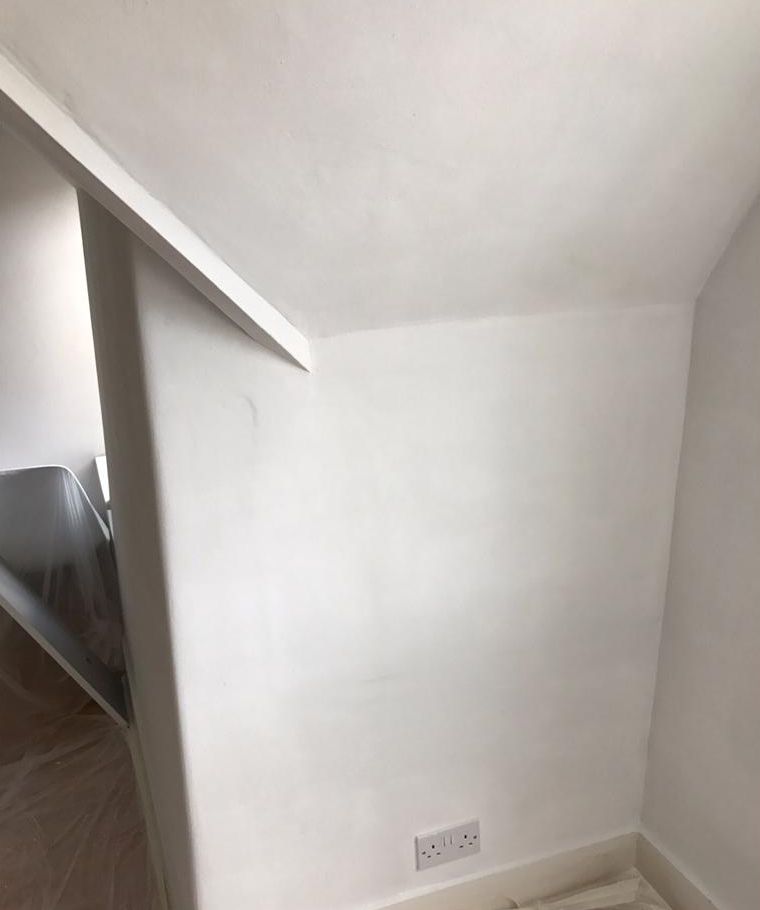 Damp proofing completed with fresh plaster and DPC injection in Surrey property