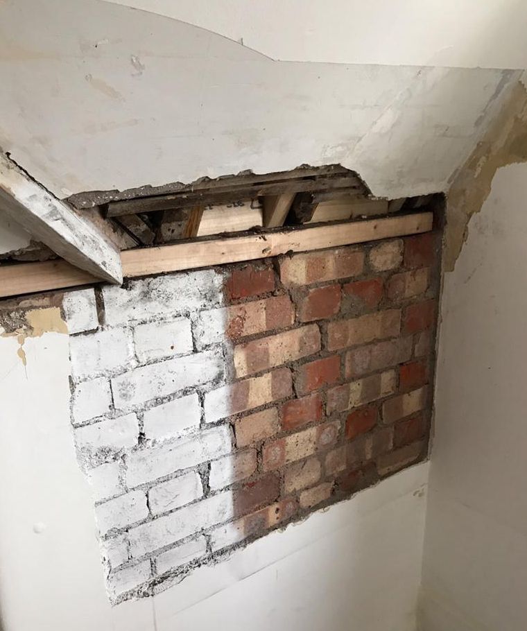 Rising damp affecting walls of a Victorian house in Surrey before treatment