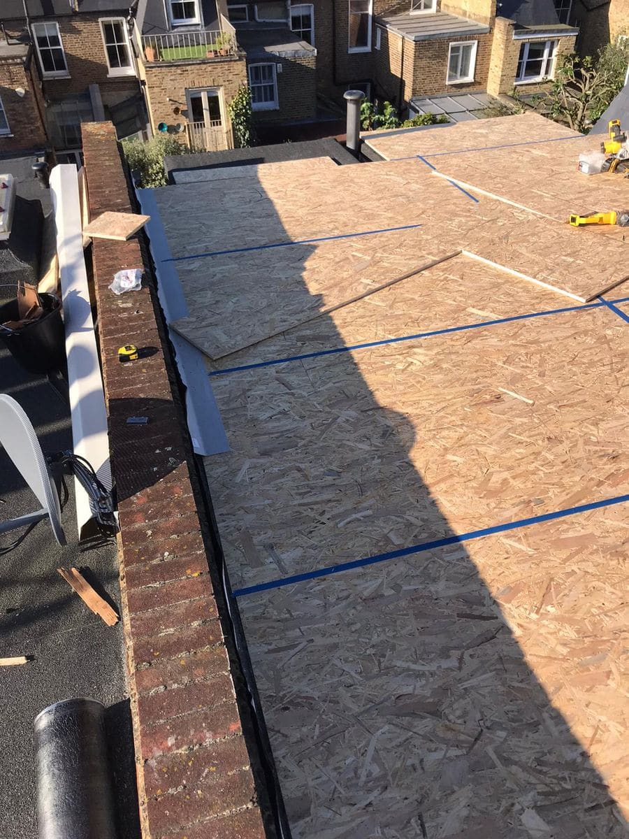 Failed felt flat roof on a rear extension in Fulham before GRP replacement