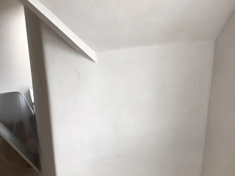 Damp proofing installation and treated wall in a London property by City Building and Roofing Ltd